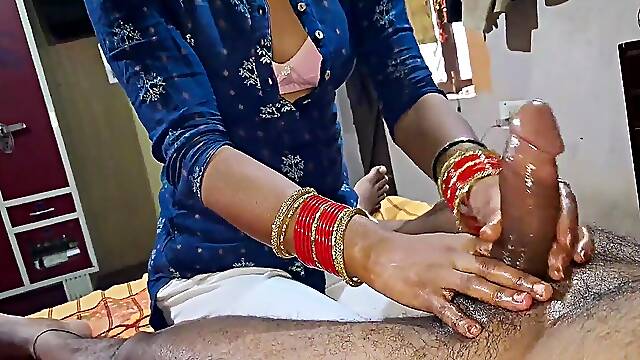 Amateur bhabhi gives a hot and oily massage to his big cock before sucking it.