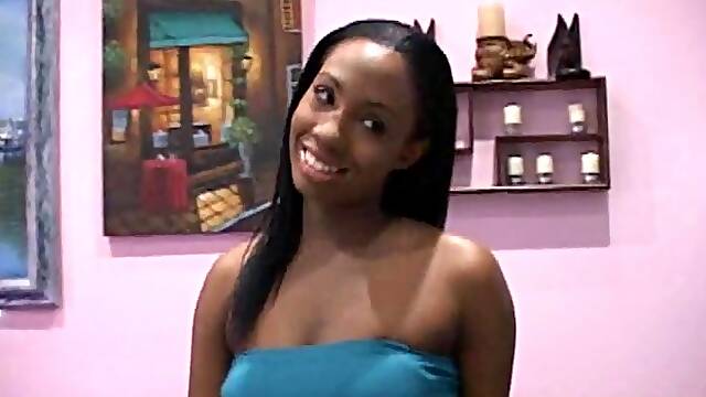 Ebony cocksucker takes a jizz bomb om her big tits after sucking a white boner