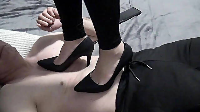Trampling on the body with heels